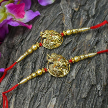 गैलरी व्यूवर में इमेज लोड करें, Sparkling Radha Krishna Golden Rakhi(Set of 2)
