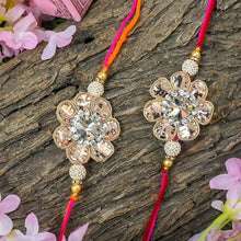 Load image into Gallery viewer, Elegant Zinnia Floral Rakhi Set of 2
