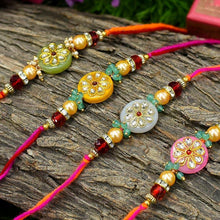 Load image into Gallery viewer, Stunning Round Kundan Rakhi Set of 4
